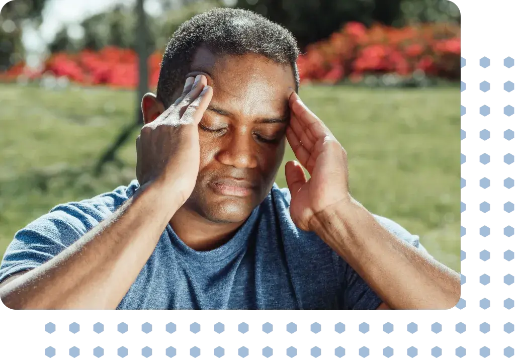A man holding his head in pain