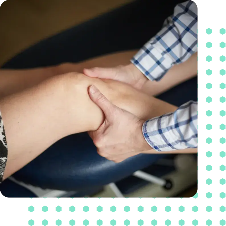 A woman having chiropractic treatment on her knee.